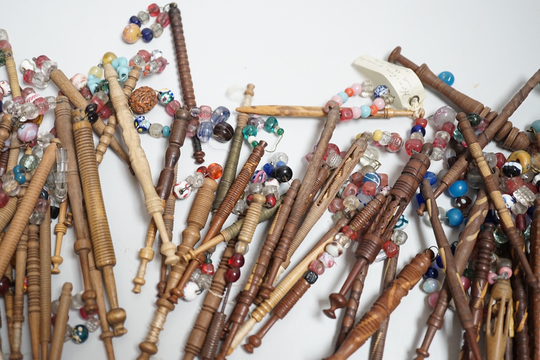 Fifty 19th century finely turned wooden lace bobbins with beaded ends together with 35 ornate wooden bobbins with beaded ends and 5 plain wooden bobbins unleaded (90)